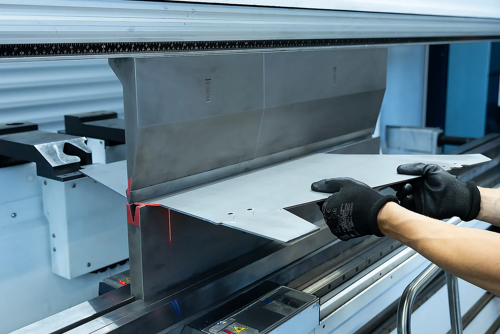 Sheet steel being folded on a CNC press brake